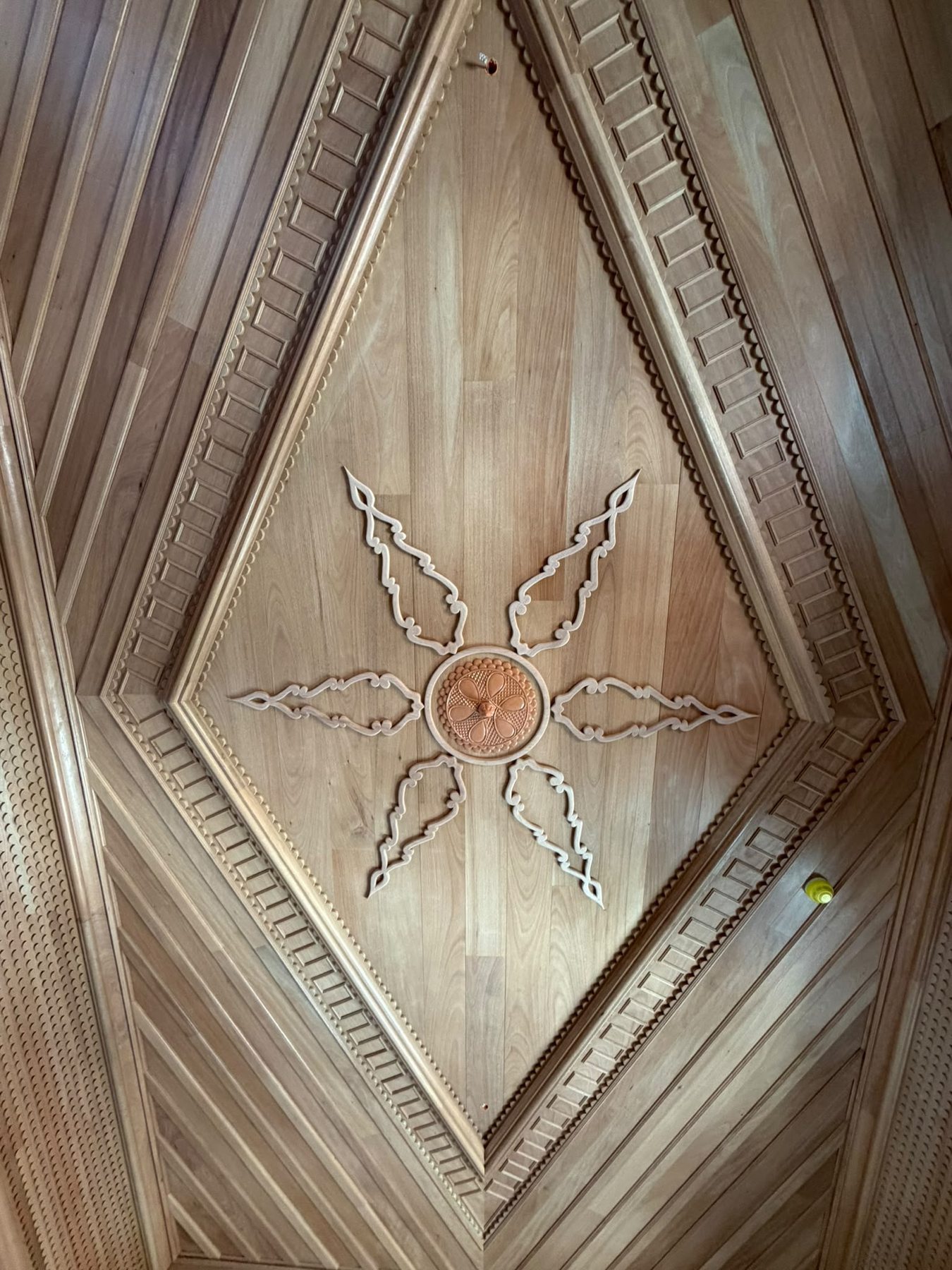 Detail of the hand-made timber ceiling with a carved star, Casa da Coroa
