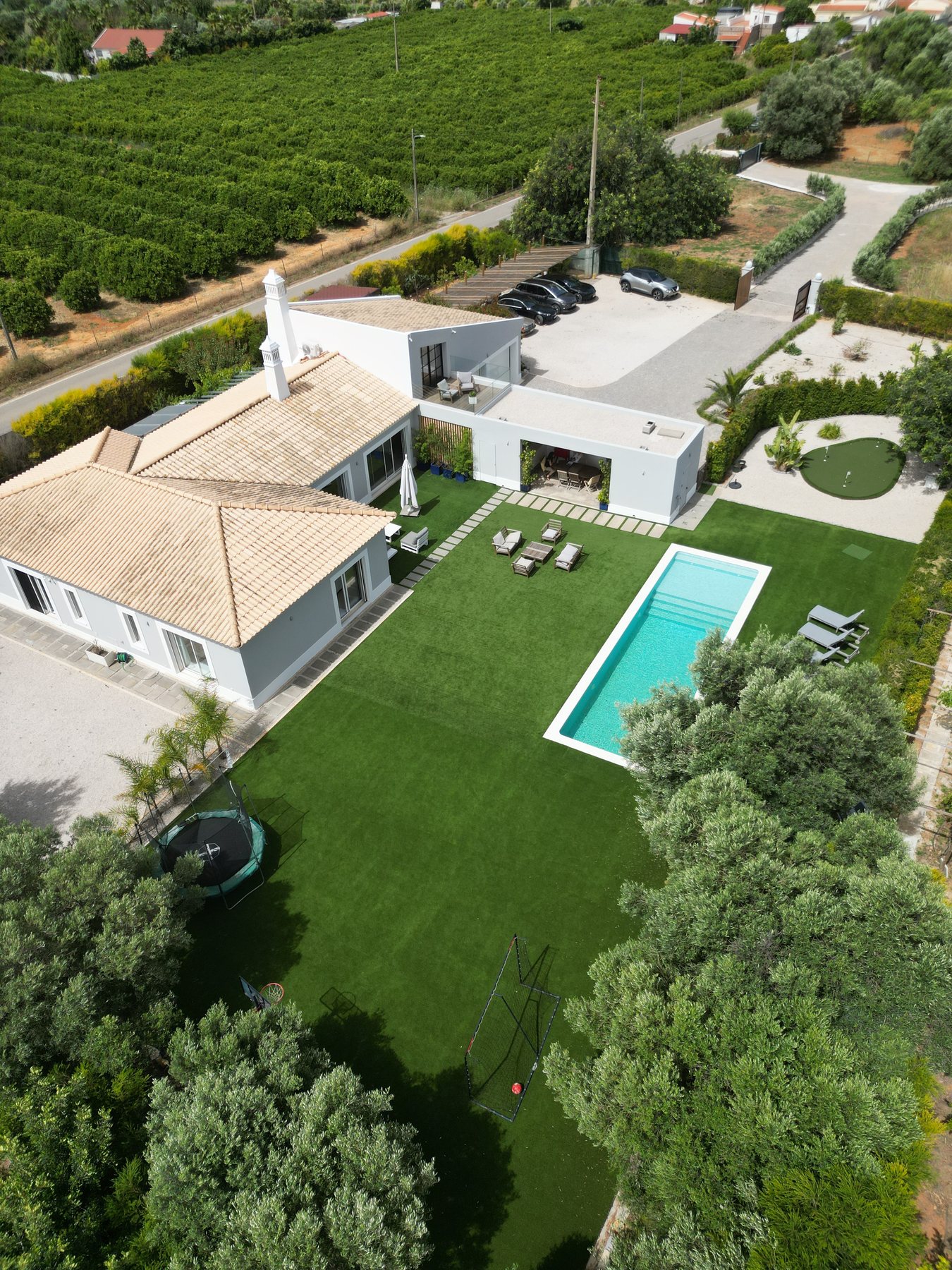 Vale da Rosa, Estoi — aerial detail of the pool deck and house roofline