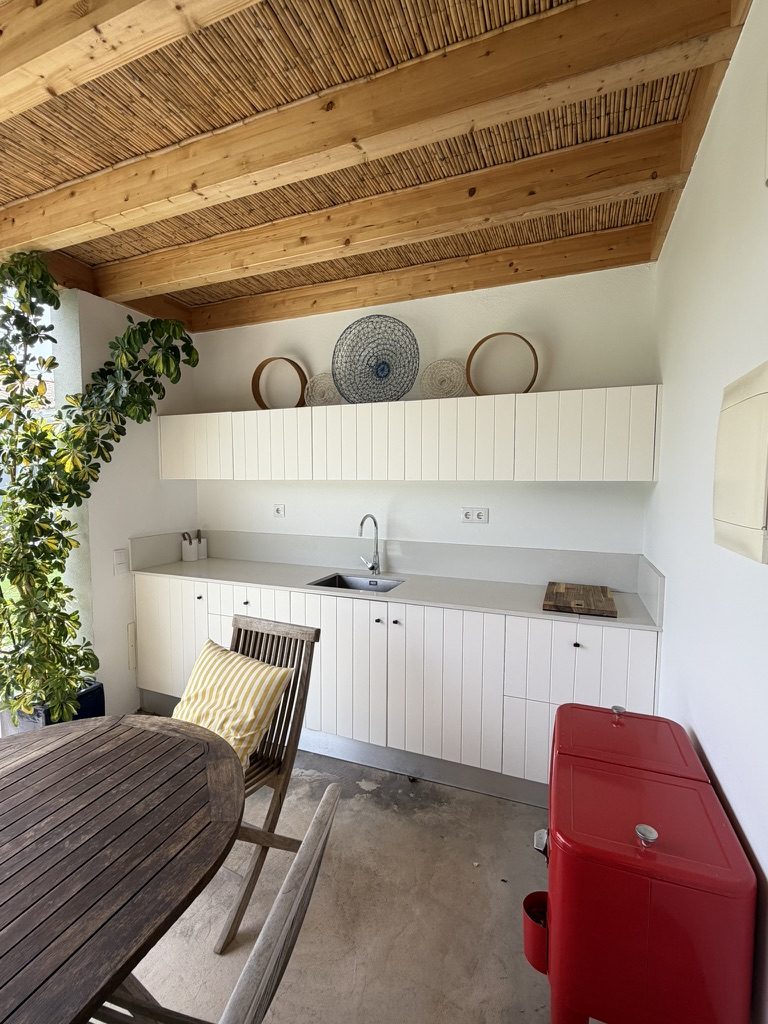 Vale da Rosa, Estoi — outdoor BBQ kitchen with white Silestone counter and TEKA appliances