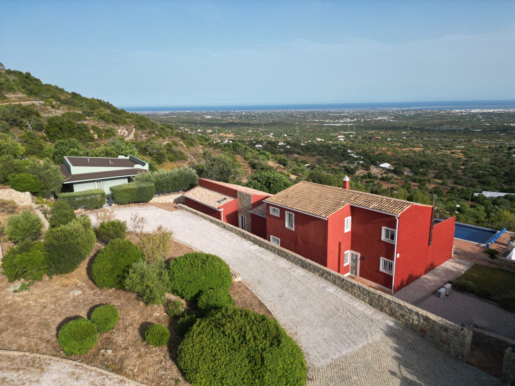 Estoi country estate — aerial showing the houses spread across the hillside plot