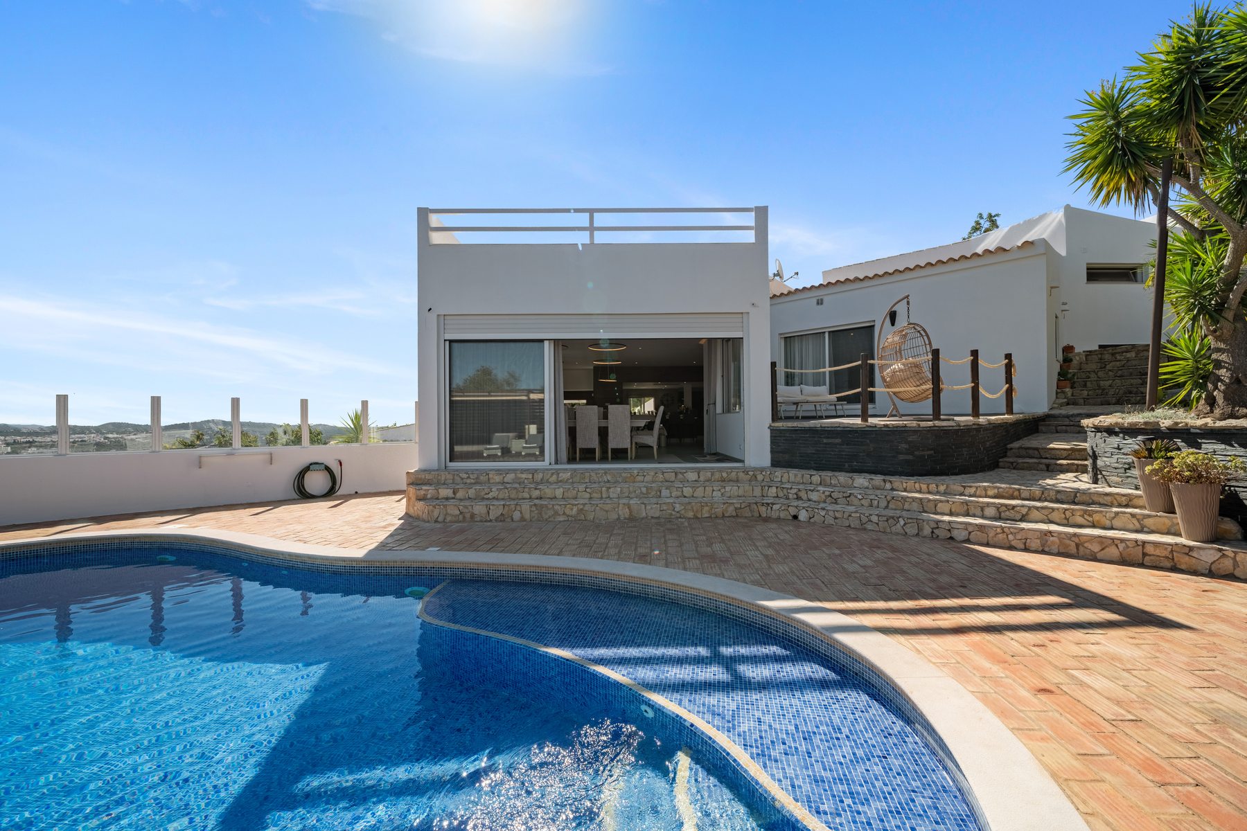 São Brás Villa — pool and decking from the garden