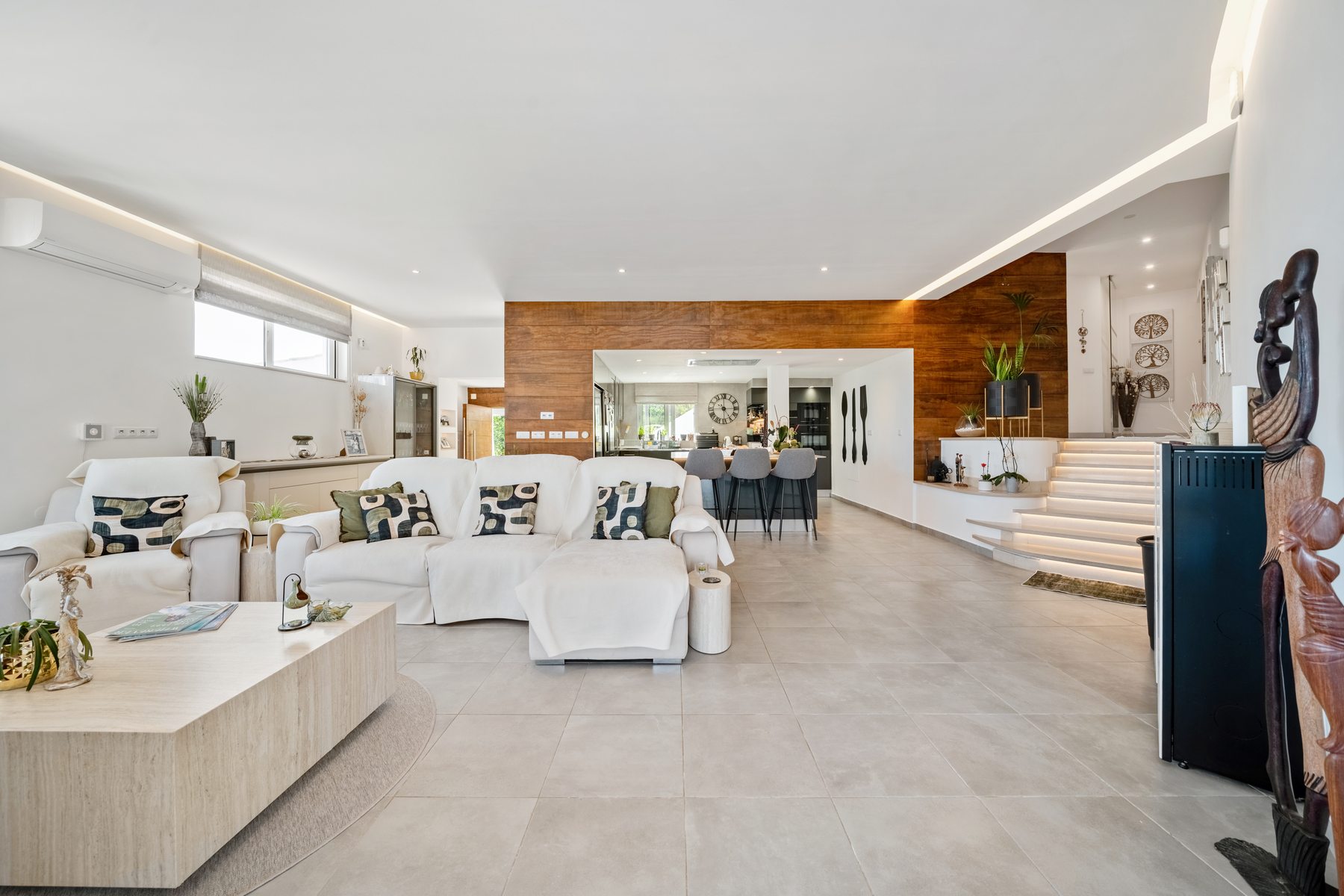 São Brás Villa — open-plan living room with stacking glass doors