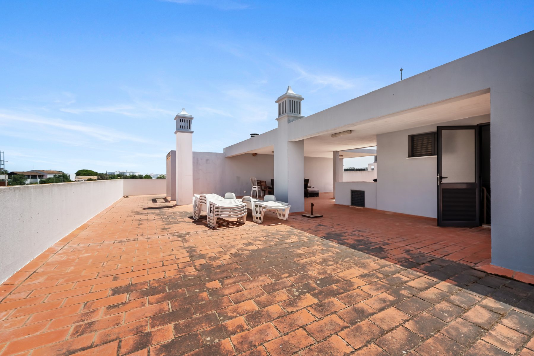 Colinas da Boavista, Tavira — private rooftop terrace with seating and open views across the town