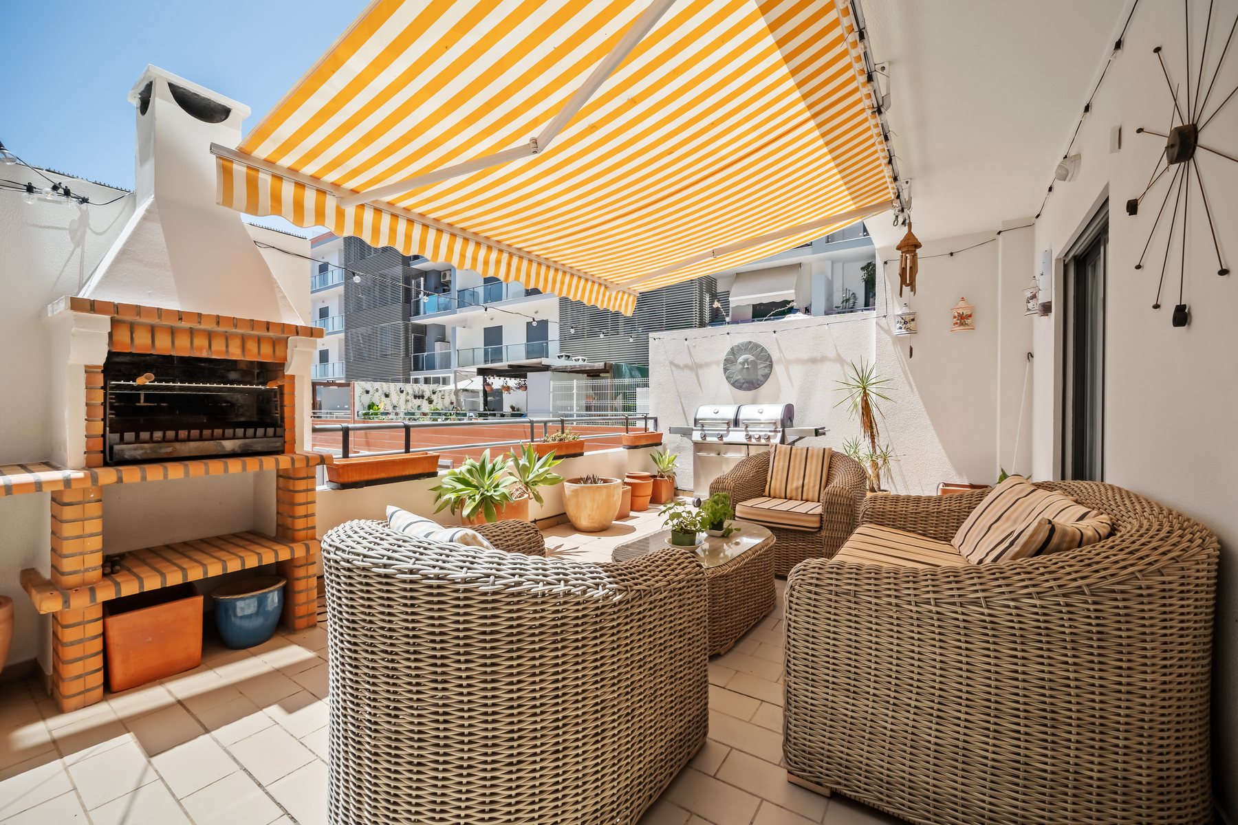 Colinas da Boavista, Tavira — terrace with awning, built-in barbecue and rattan seating