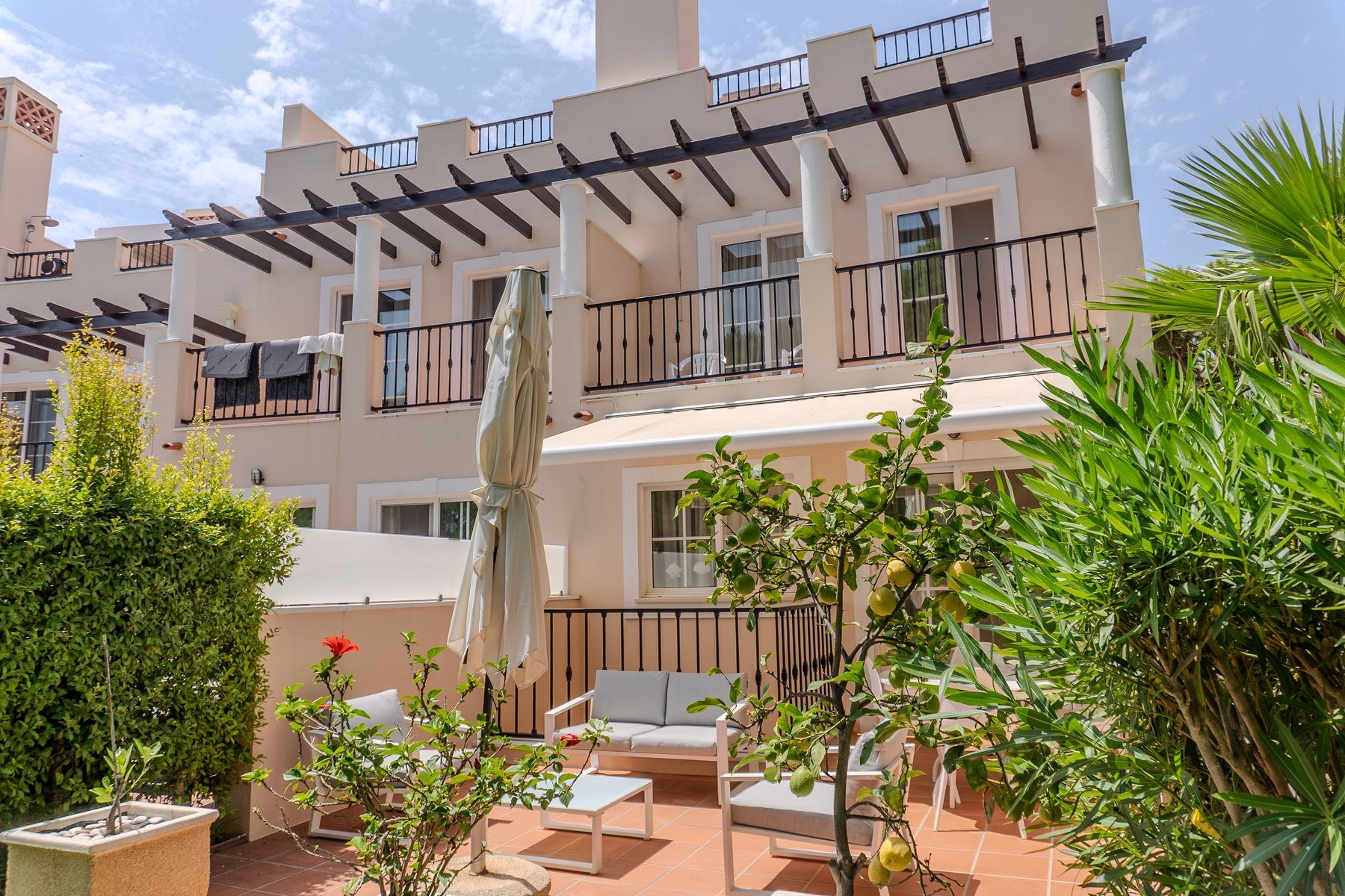 Vila Sol end-terrace, Palmyra — rear facade and garden terrace